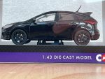Side view of black Ford Focus RS die-cast model in Corgi packaging