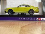 Side view of yellow Ford Mustang Mach 1 die-cast model in Corgi packaging