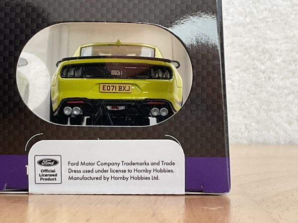 Rear view of lime green Ford Mustang Mach 1 die-cast model in box with E071 BXJ plate