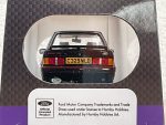 Rear view of a black die-cast Ford Escort XR3i model with UK plate C329 WLD