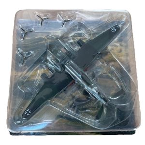 Diecast model of a German WWII military aircraft with swastika insignia, encased in clear plastic packaging